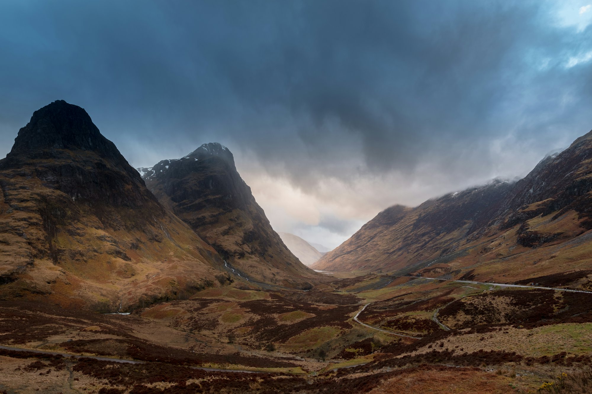 The mountains of Glen Coe under a stormy sky